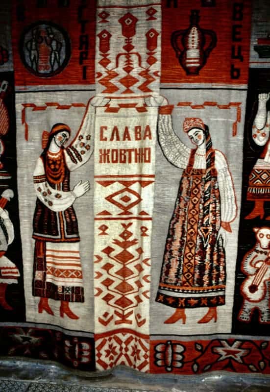 'Glory to October' (ie to the Revolution). Girls in folk dress of Ukraine (l) and Russia (r)